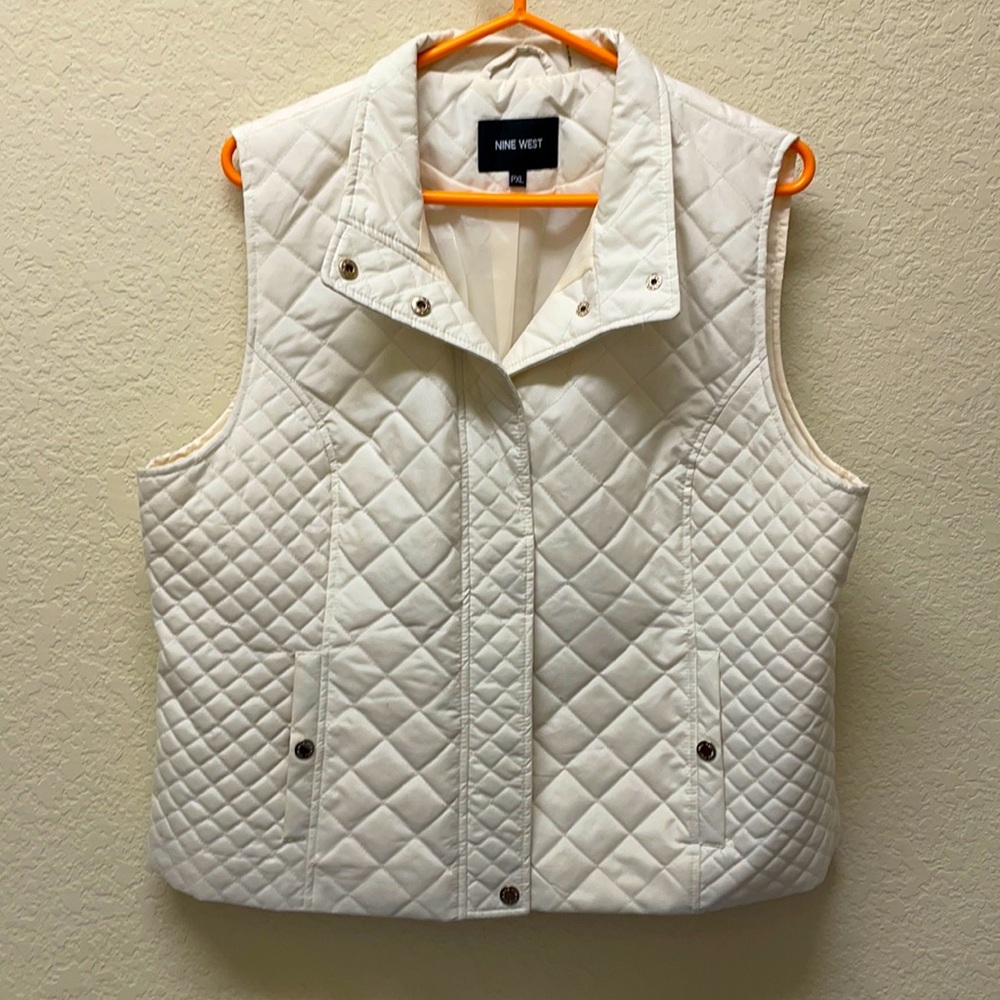 Cream Nine West puffer vest.